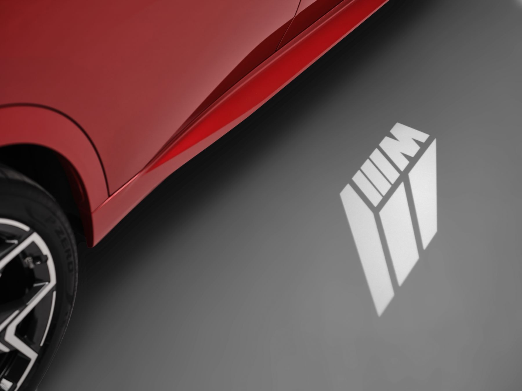 Vista trasera del BMW iX2 en un entorno natural, resaltando su presencia.