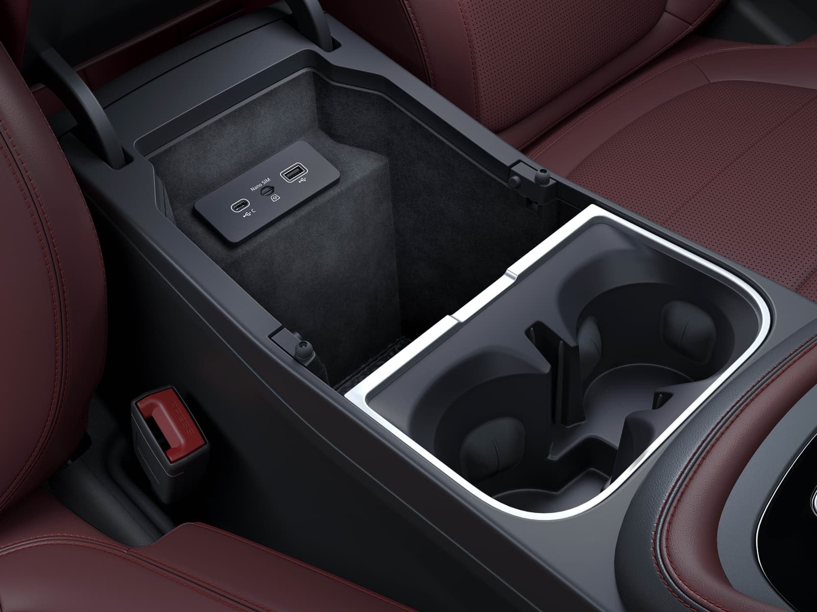 Detalle de la consola central del E-Pace con portavasos y compartimientos.