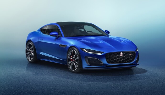 Imagen frontal del Jaguar F-Type resaltando su parrilla característica y faros afilados. Imagen frontal del Jaguar F-Type resaltando su parrilla característica y faros afilados.