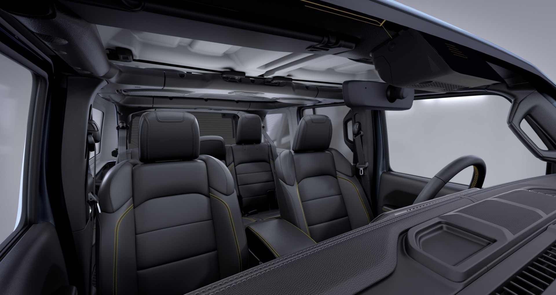 Interior mostrando el techo panorámico y disposición de asientos del Jeep Wrangler.