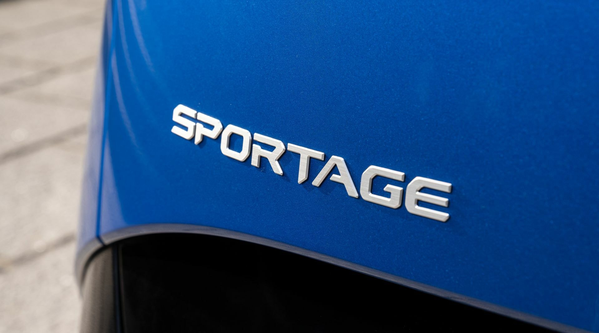 Insignia Sportage en color distintivo, identidad de la marca.