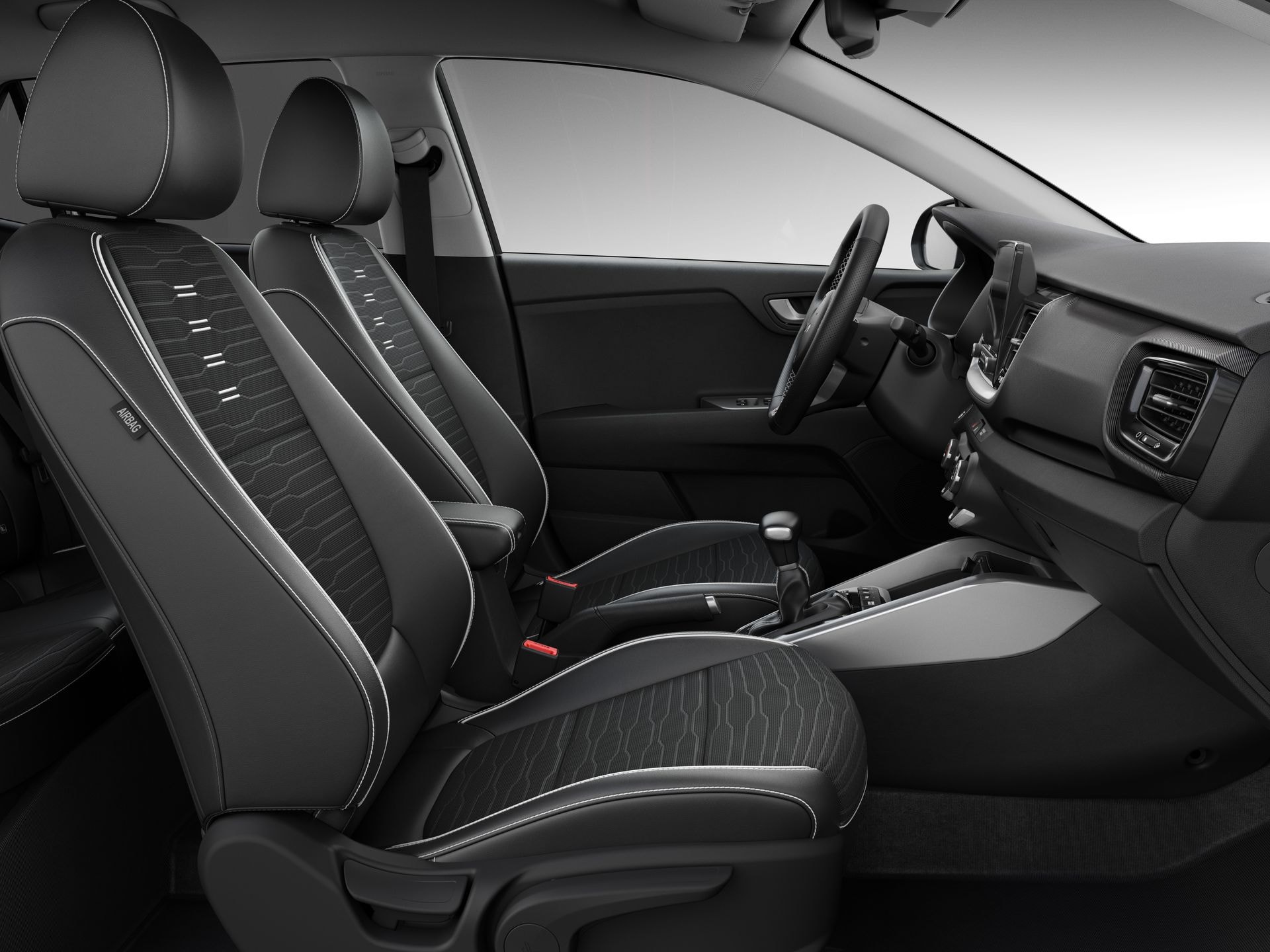 Cabina del Kia Stonic mostrando asientos delanteros y detalle de consola central.