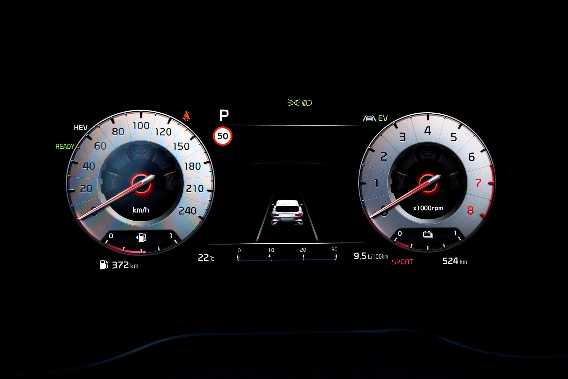 Cuadro de instrumentos analógico del Kia Xceed Híbrido con iluminación roja.