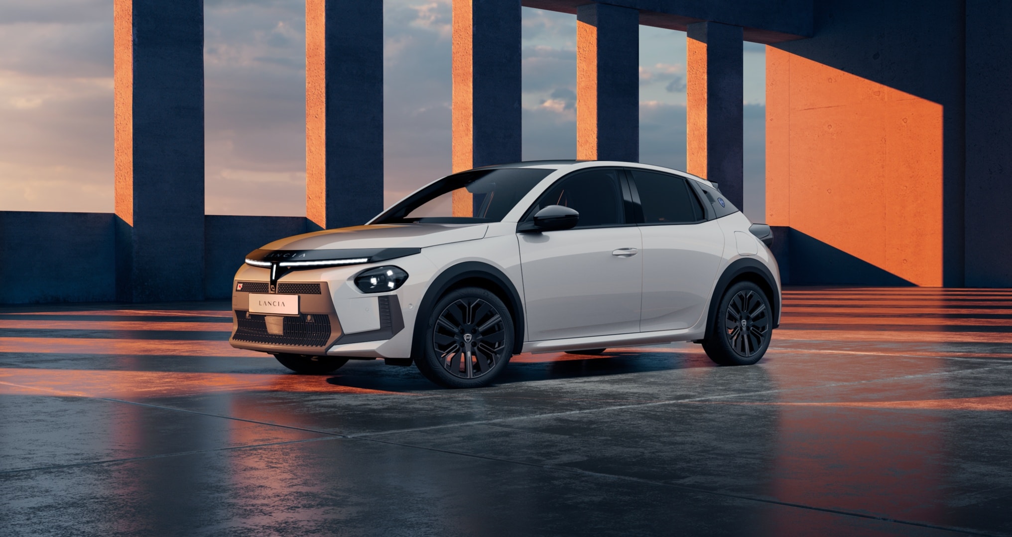 Vista lateral y delantera del Lancia Ypsilon, destacando su diseño moderno y dinámico.