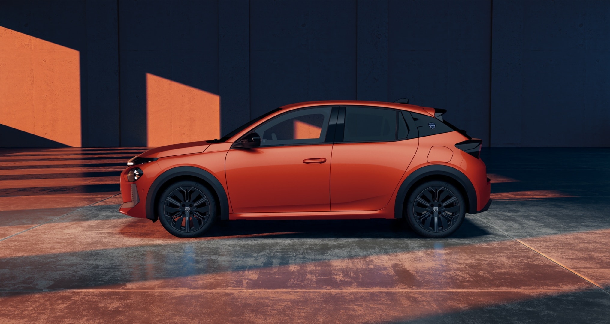 Perspectiva frontal del Lancia Ypsilon, resalta su distintivo estilo y tecnología.