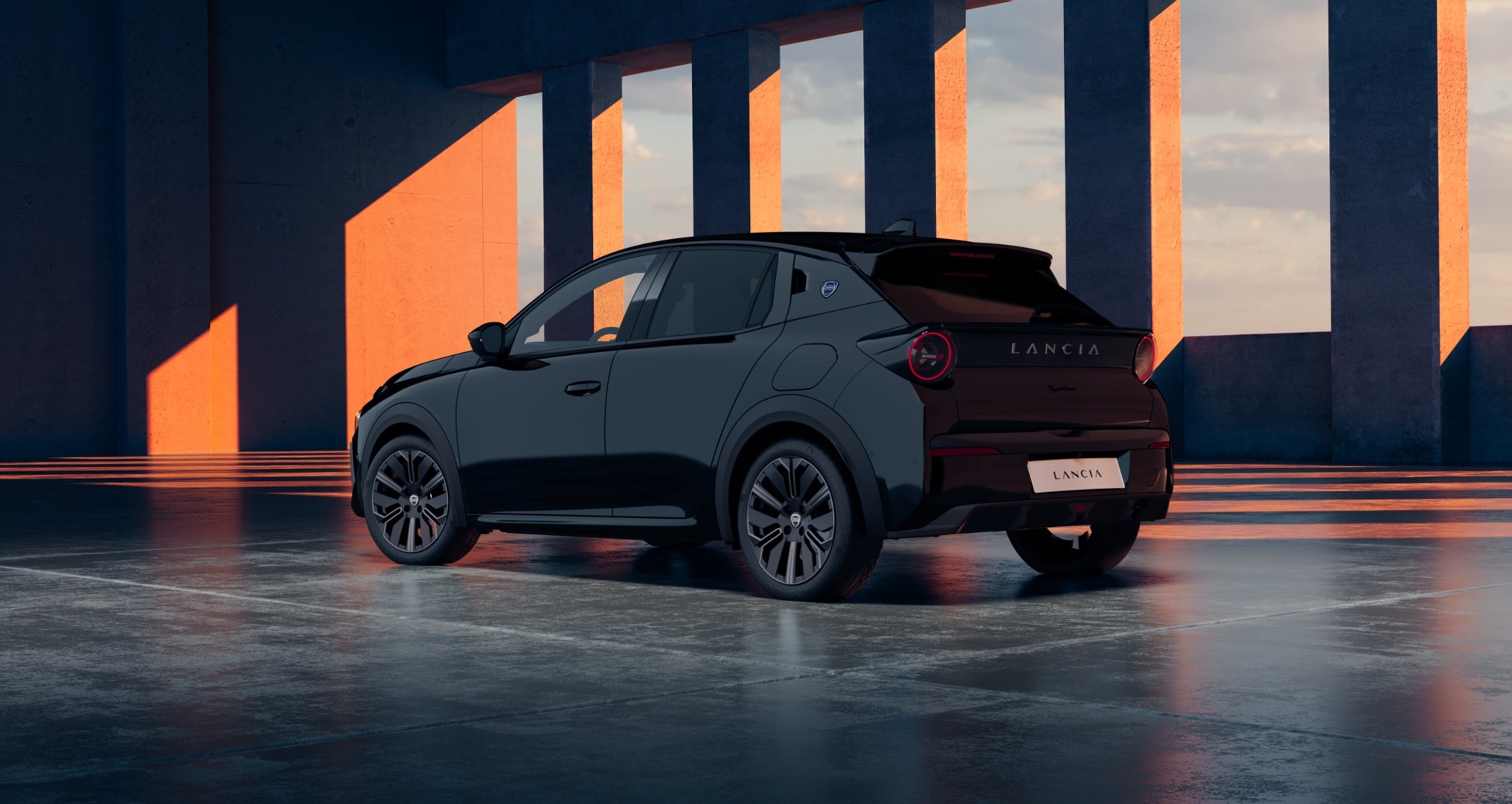 Impactante imagen del Lancia Ypsilon negro desde el frente, refleja modernidad.