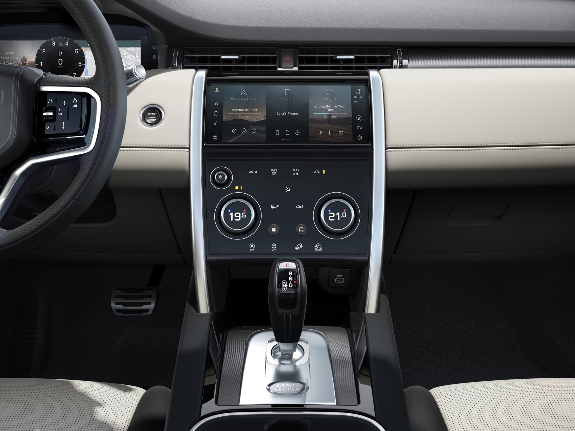 Consola central del Discovery Sport con pantalla táctil y controles climatización.