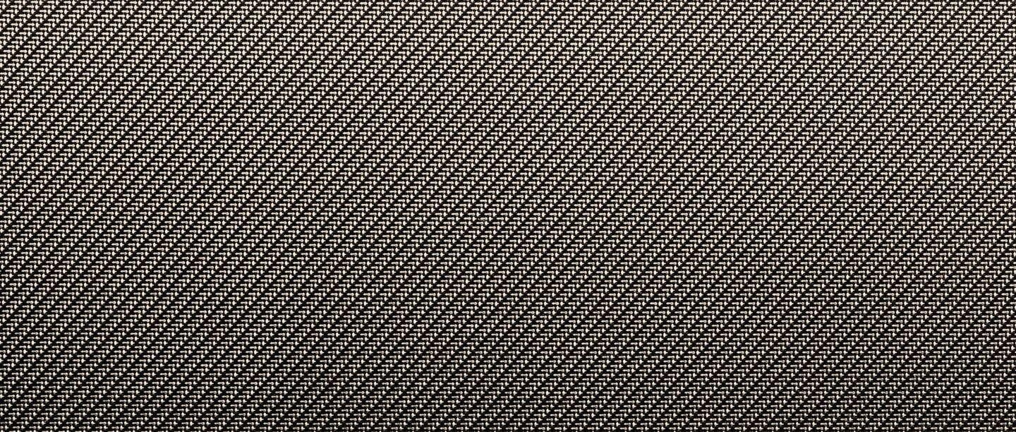 Primer plano de la textura de los asientos, resaltando la calidad de los materiales.