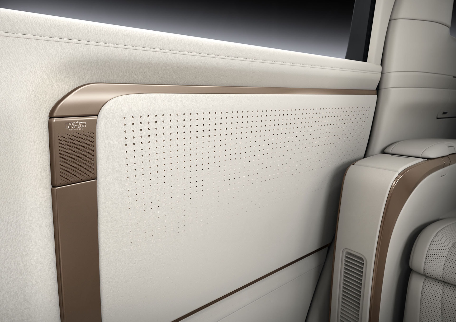 Detalle del panel de la puerta con altavoz y acabados premium en el Lexus LM.