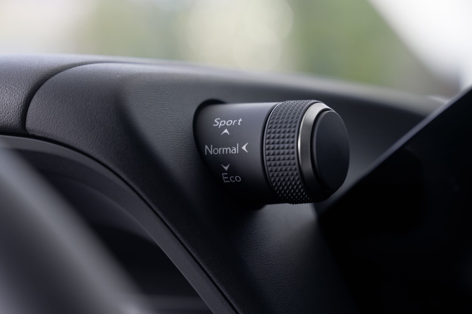 Selector de modo de conducción con opciones Sport, Normal, Eco.