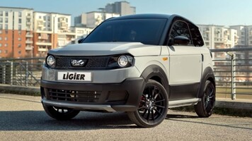 Vista lateral del Ligier Myli, resaltando su diseño moderno y robusto. Vista lateral del Ligier Myli, resaltando su diseño moderno y robusto.