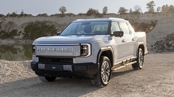 Vista frontal y lateral del Maxus eTerron 9, destacando su diseño robusto. Vista frontal y lateral del Maxus eTerron 9, destacando su diseño robusto.