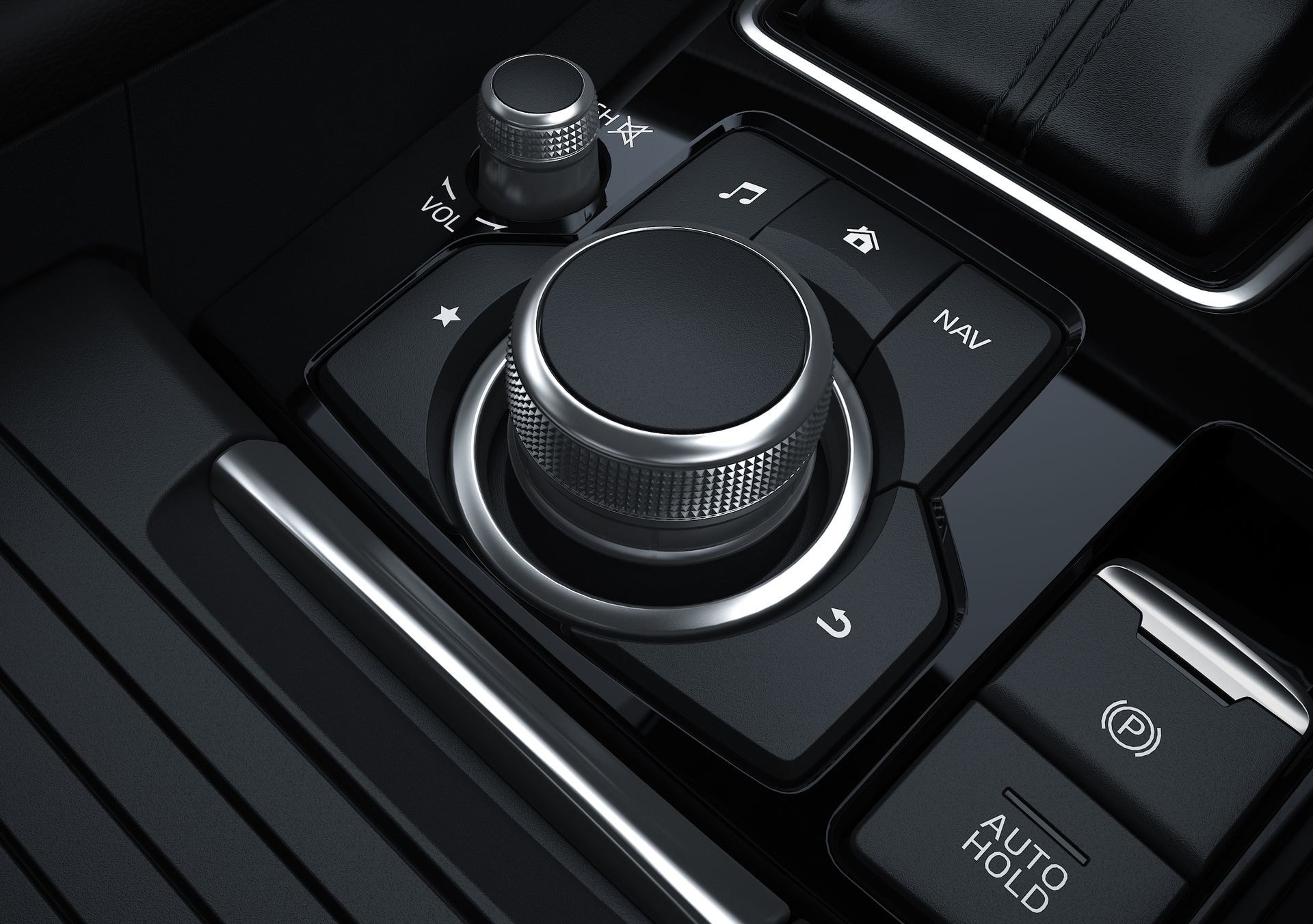 Detalle del mando de sistema multimedia en la consola central del Mazda 6.