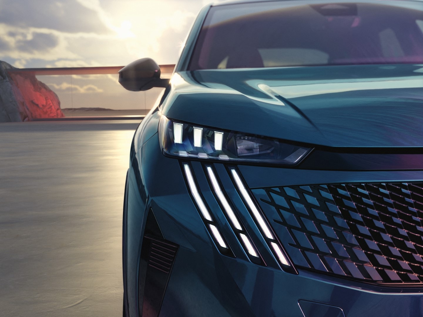 Enfoque en el frontal del Peugeot 3008 eléctrico, mostrando líneas agresivas y elegantes.