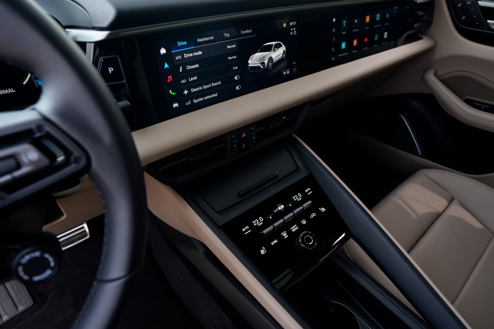 Vista de la consola central con pantalla táctil y controles climáticos del Porsche Macan.