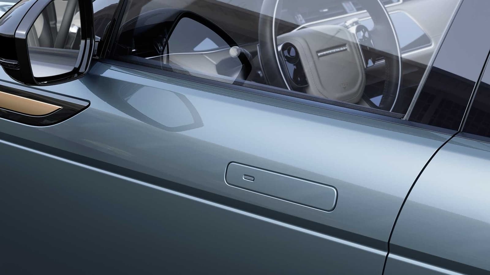 Vista de la manija exterior retráctil del Evoque, diseño minimalista.