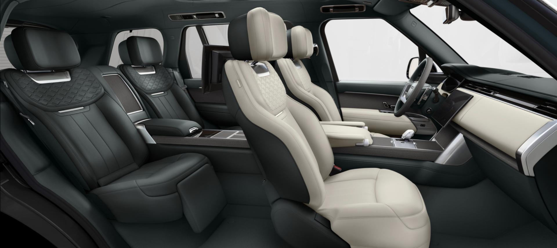 Espacio interior del Range Rover híbrido con asientos de diseño ergonómico y aspecto moderno.
