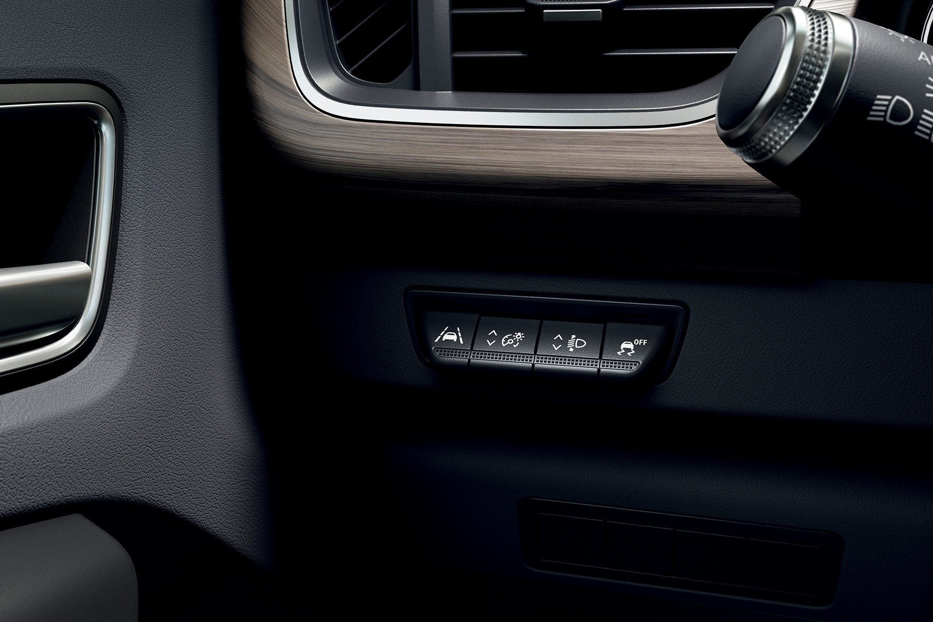 Botonera de ajuste de espejos laterales y elevalunas.