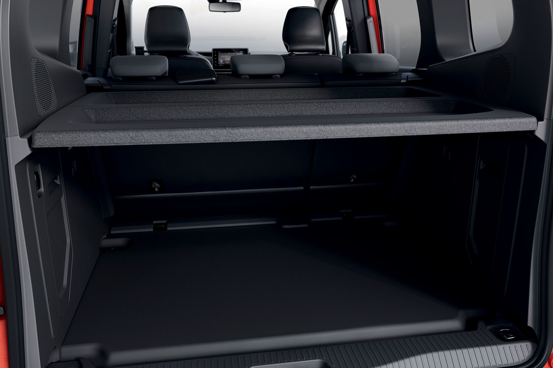 Espacio de carga tras asientos traseros, versátil y funcional.