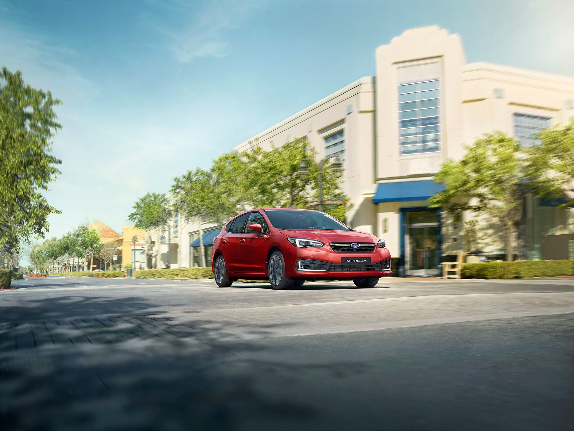 Vista dinámica del Subaru Impreza híbrido en rojo.