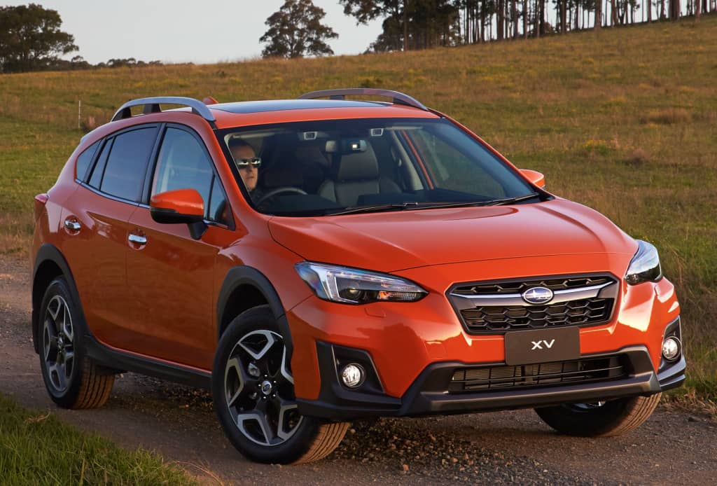 Subaru XV en color naranja brillante, preparado para la aventura off-road.