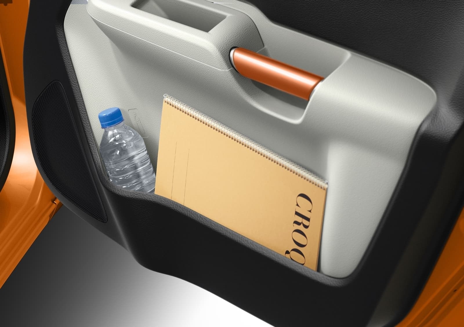 Espacio de almacenamiento en puerta con diseño ergonómico.