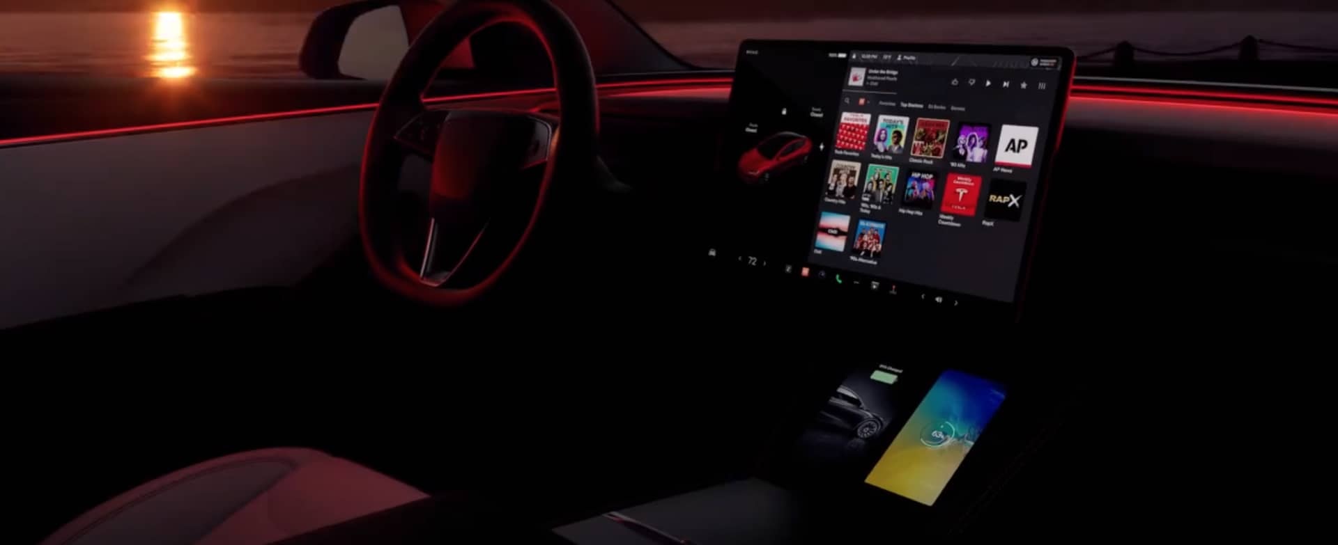 Vista nocturna del tablero y pantalla central del Tesla Model 3.