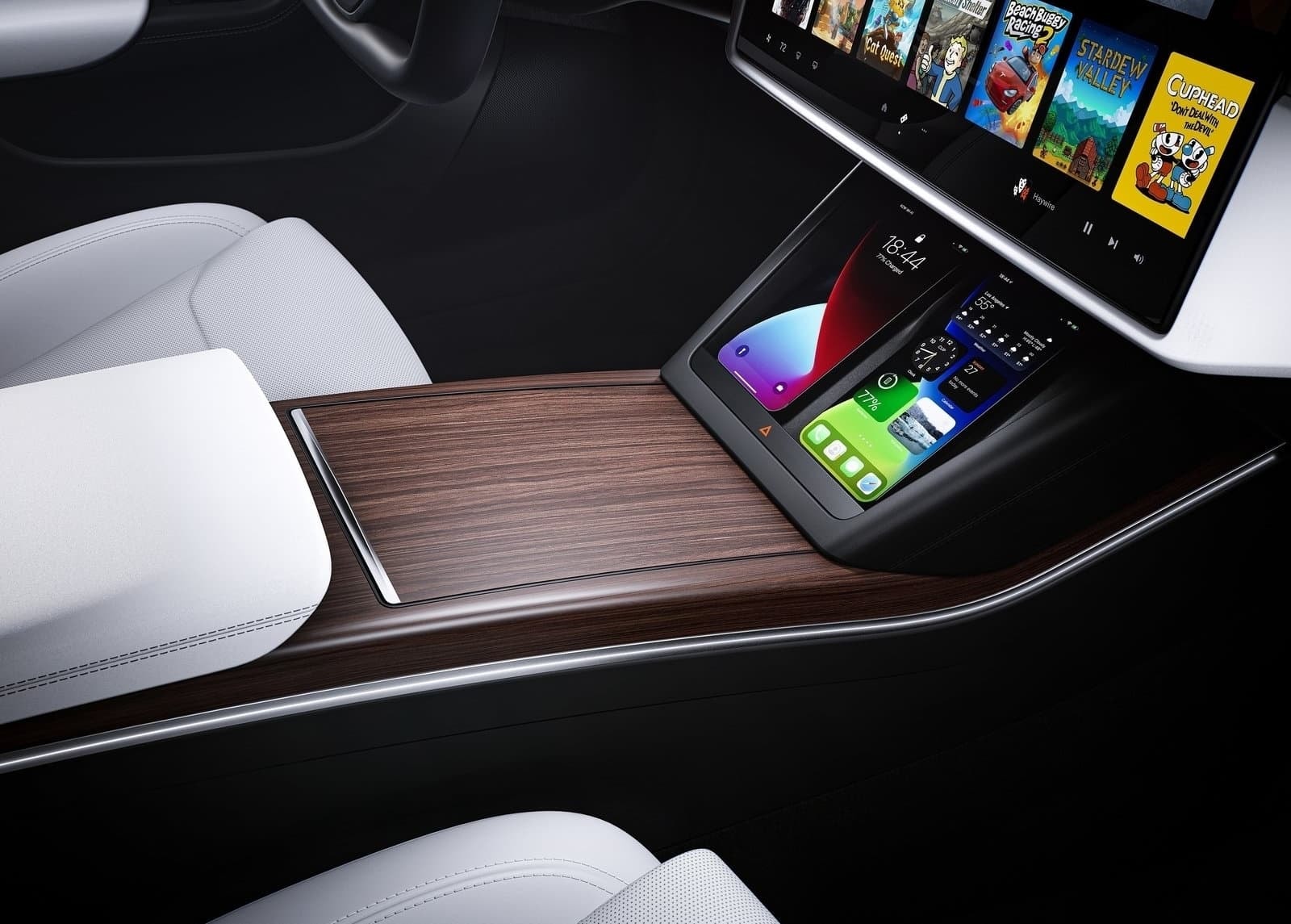 Consola central entre los asientos delanteros con pantalla táctil en un Tesla Model S.