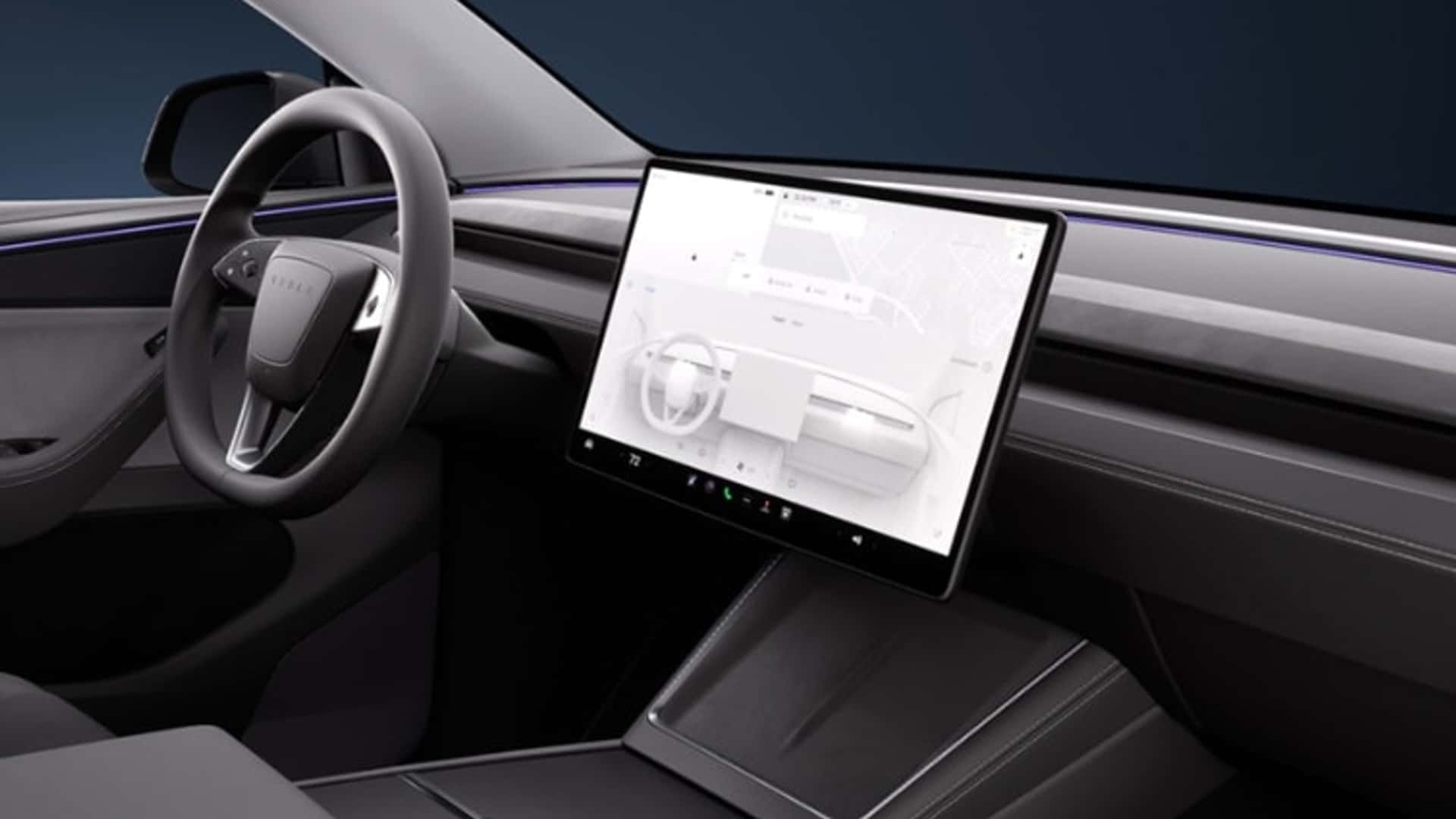Vista del interior del Tesla Model Y, con su pantalla central prominente y diseño moderno.