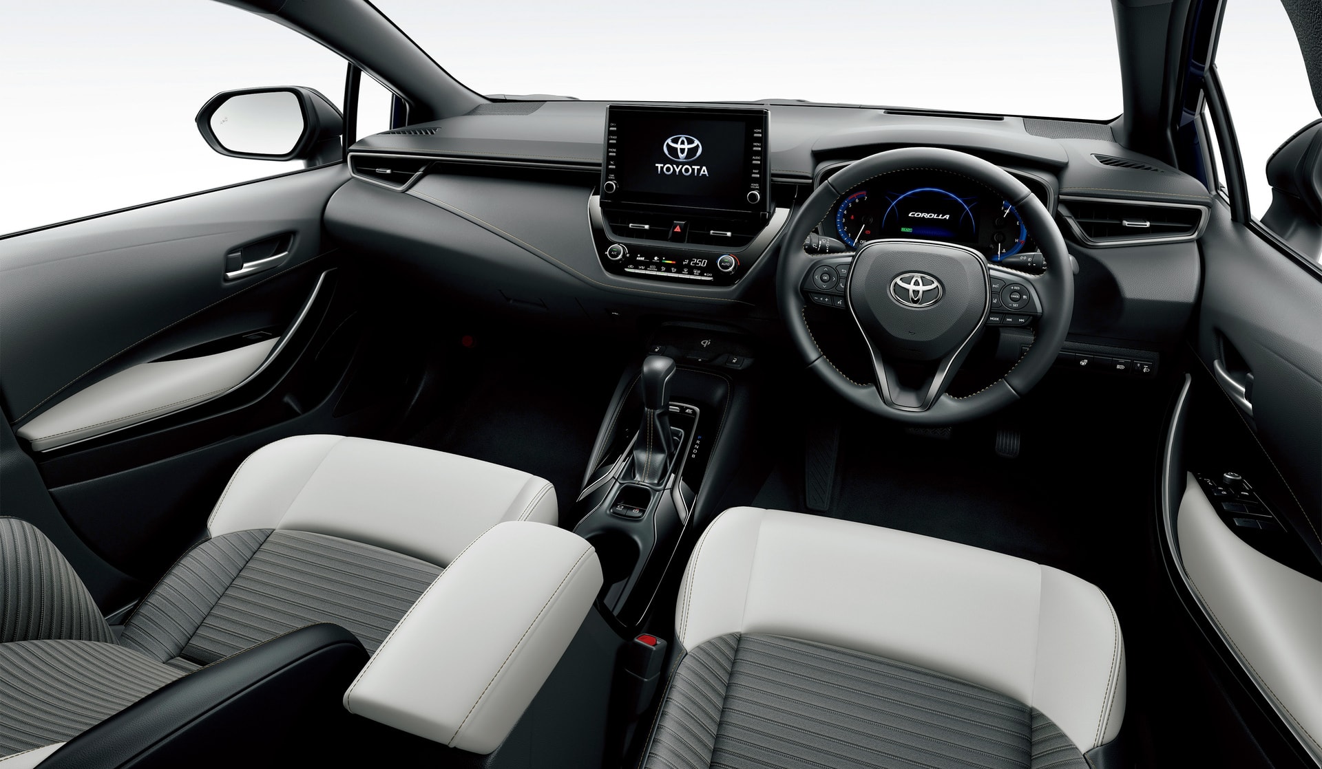 Interior del Toyota Corolla Touring Sports que muestra un diseño moderno y asientos bicolores.
