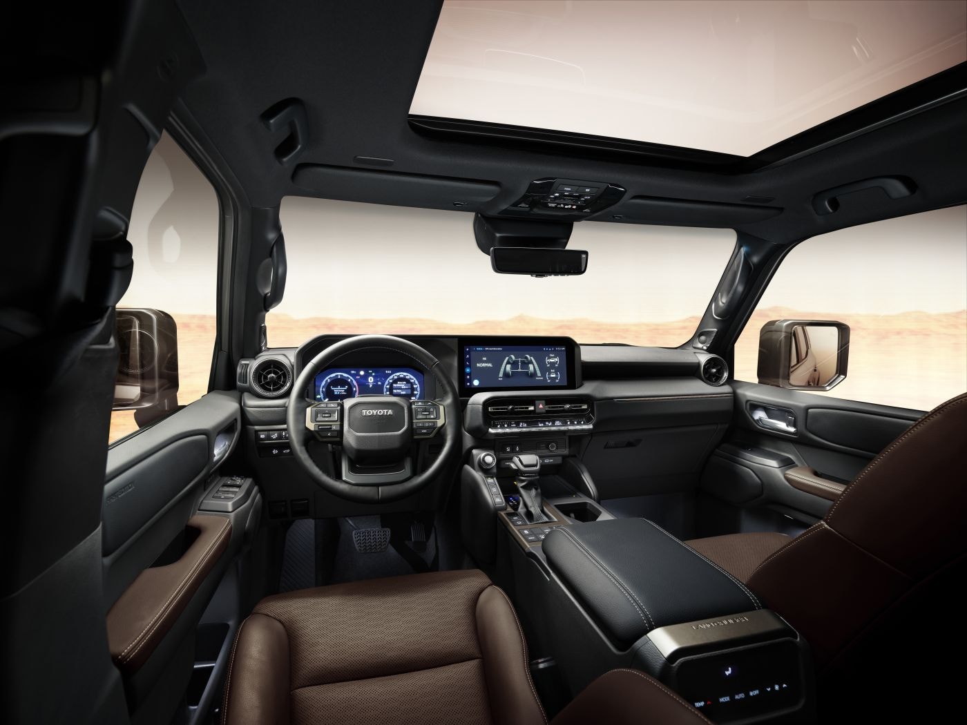 Detallada visión del interior, mostrando tecnología y comodidad en la cabina del Land Cruiser.