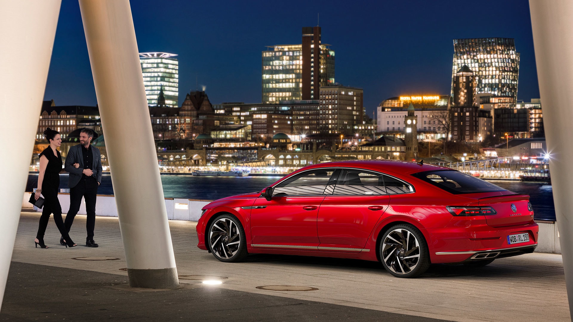 Arteon en la ciudad de noche, trasfondo social añadido.