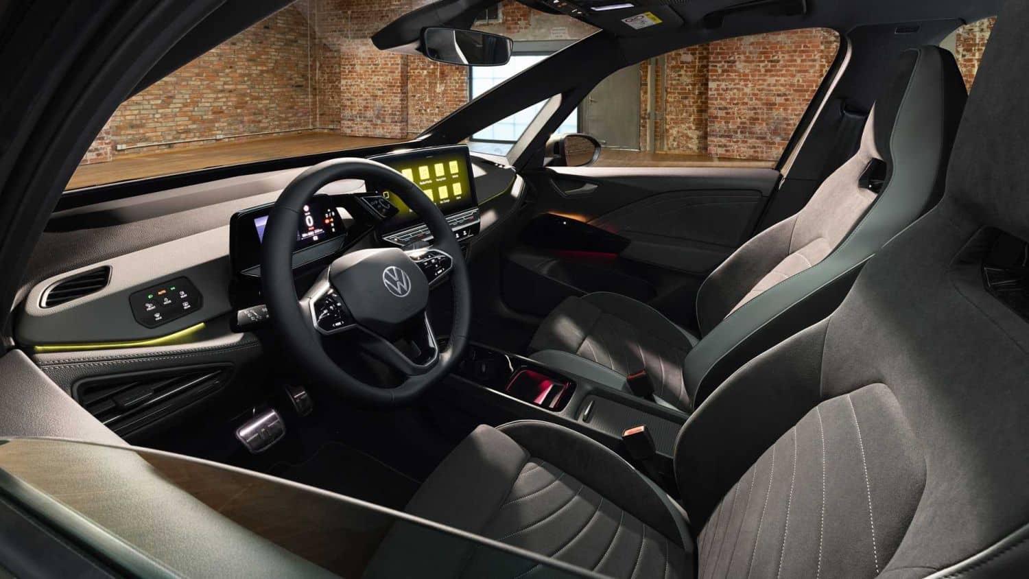Interior del Volkswagen ID.3 con enfoque en el volante y los asientos delanteros.